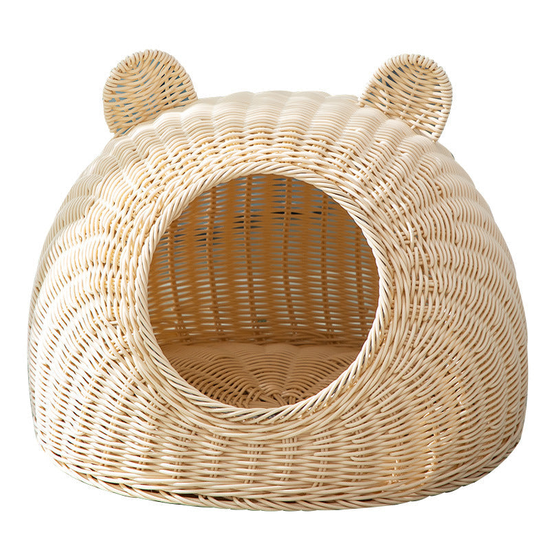 Beige cat bed in molded plastic with a woven rattan look