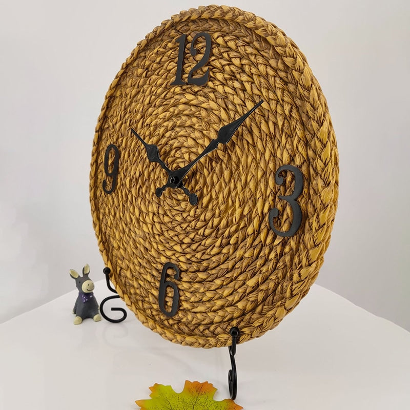Round woven look resin wall clock with large black numbers