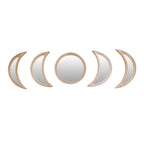 Row of rattan framed mirrors shaped as moon phases