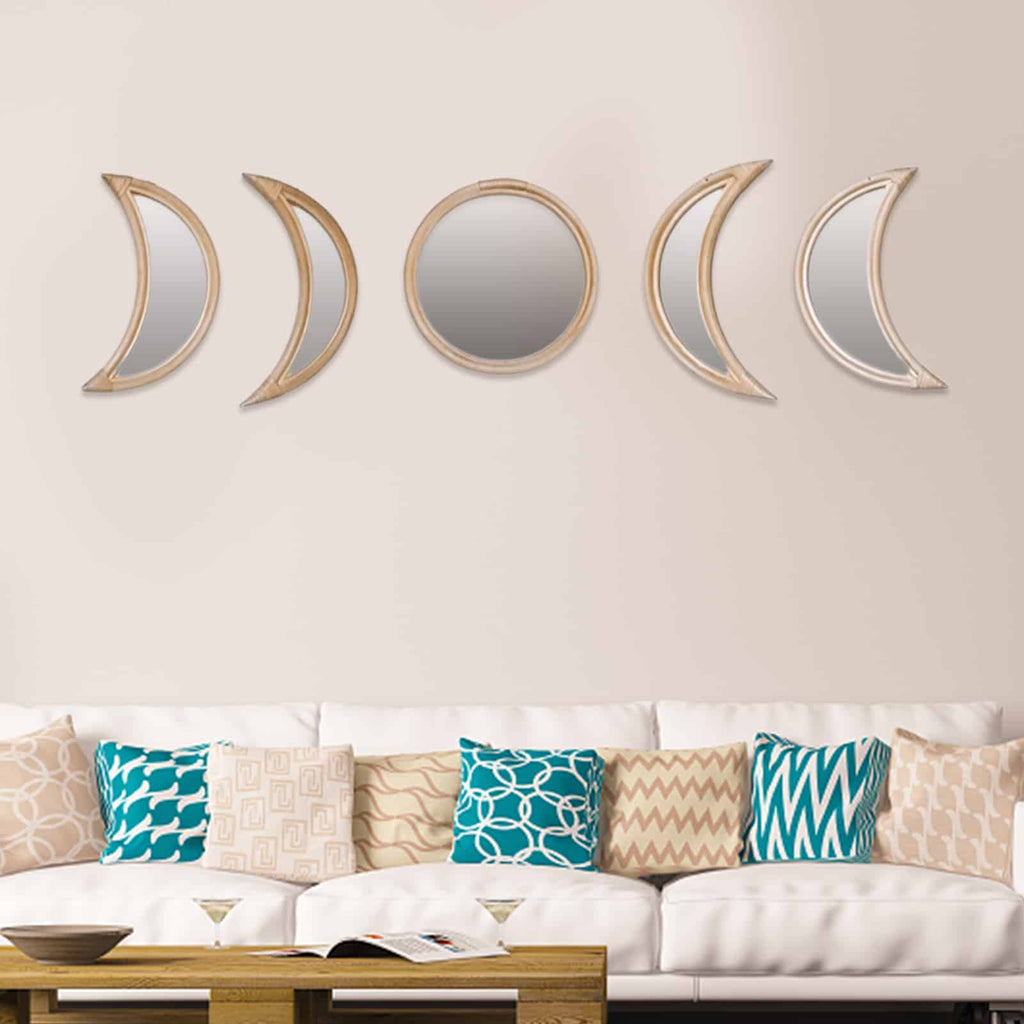 Row of rattan framed mirrors shaped as moon phases