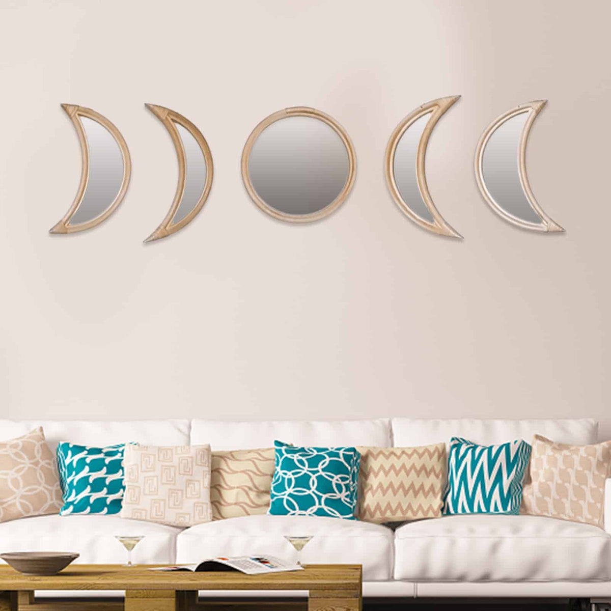 Row of rattan framed mirrors shaped as moon phases
