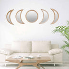 Row of rattan framed mirrors shaped as moon phases