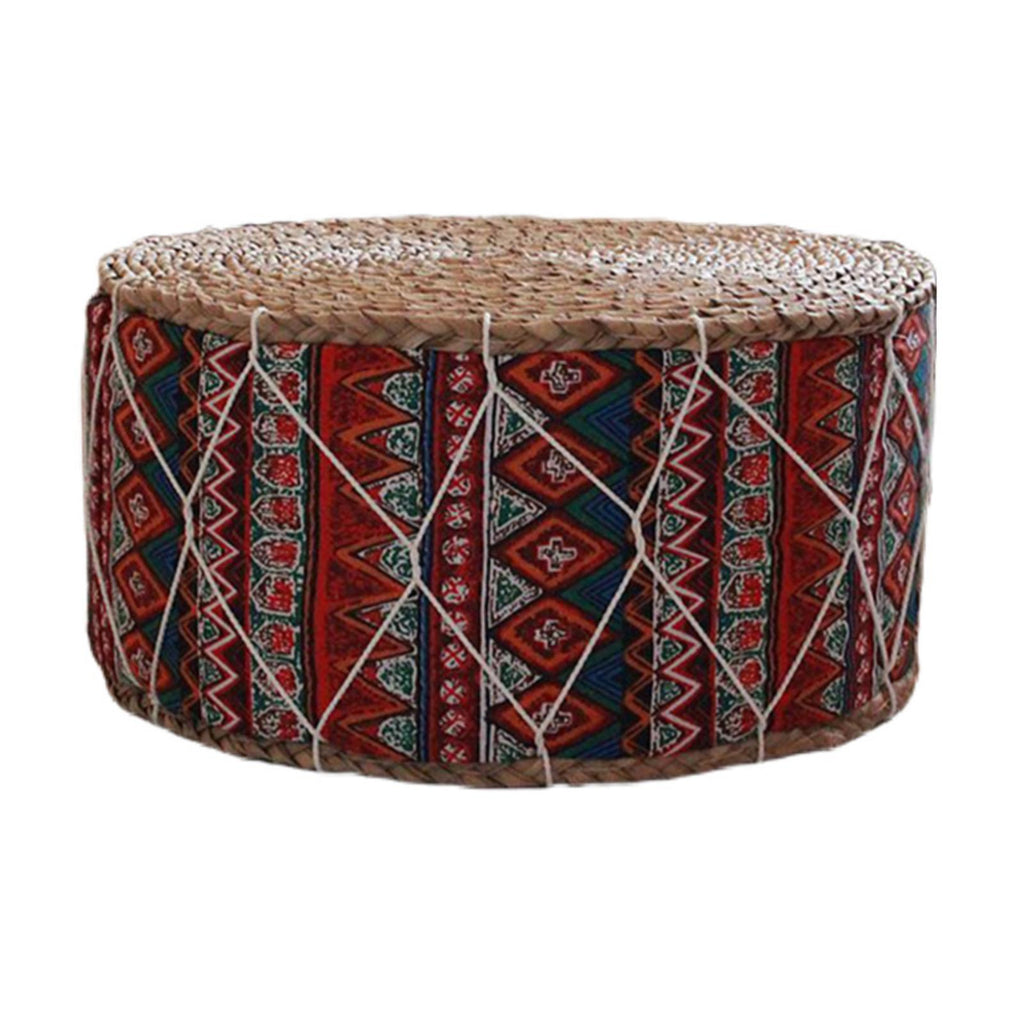Round hand woven rattan pouf with red and blue geometric patterns