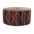 Round hand woven rattan pouf with red and blue geometric patterns