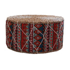 Round hand woven rattan pouf with red and blue geometric patterns