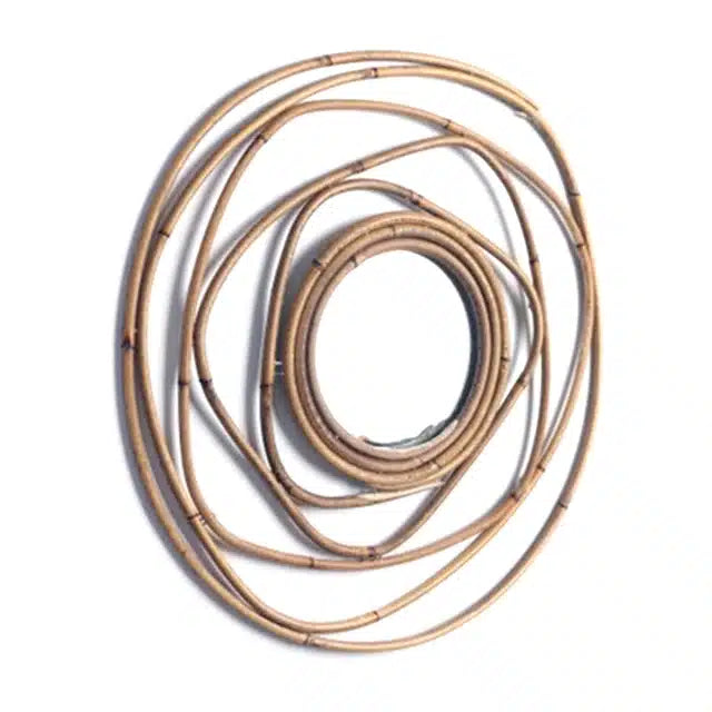 Round mirror framed by overlapping rattan rings