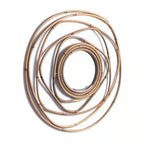 Round mirror framed by overlapping rattan rings