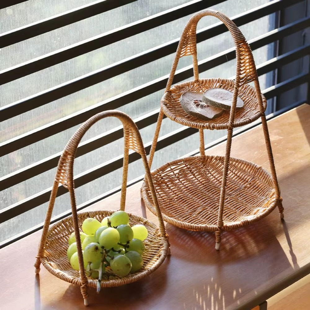 Rattan tiered basket stand with a carrying handle on a patio table