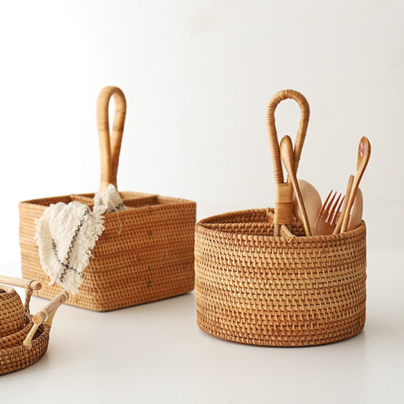 Round and square rattan utensil holders with wooden spoons