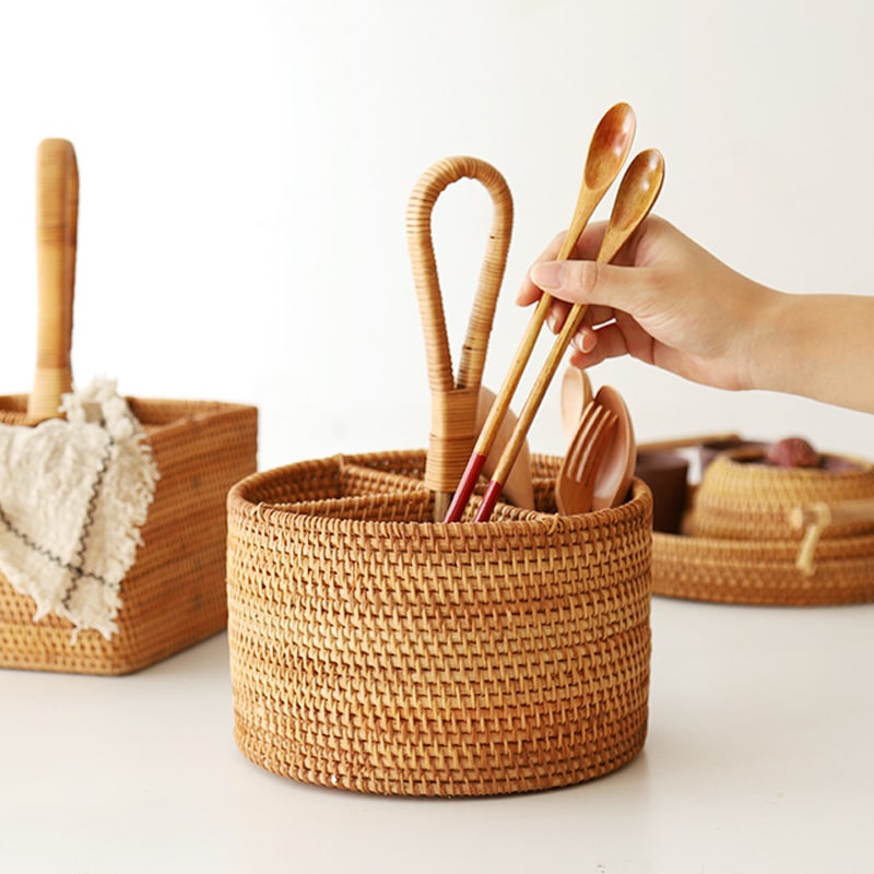 Round and square rattan utensil holders with wooden spoons