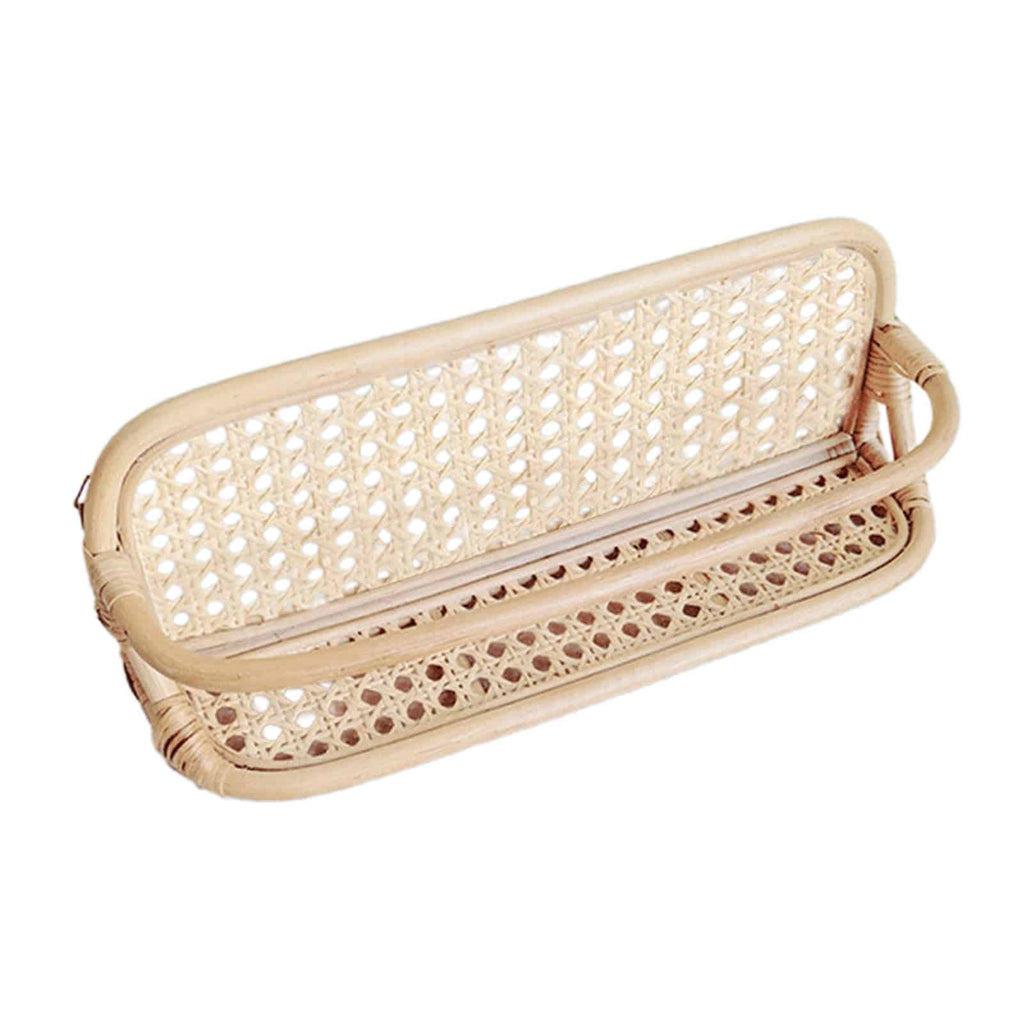 Hand woven rattan wall rack with metal coat hooks in a warm beige