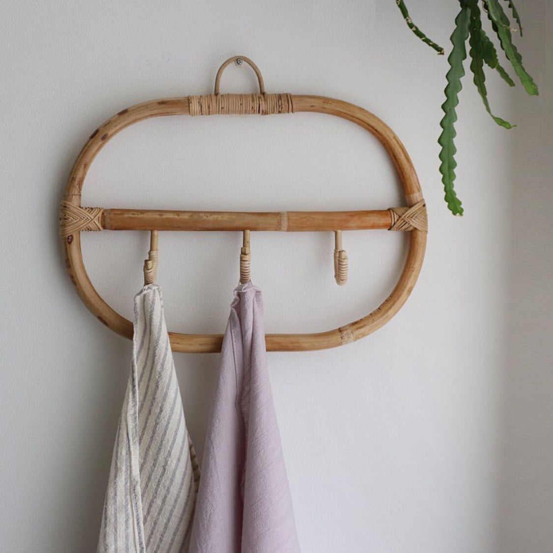 Rounded rectangle rattan wall coat rack with three hand woven hooks