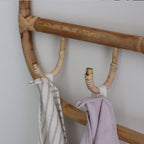 Rounded rectangle rattan wall coat rack with three hand woven hooks