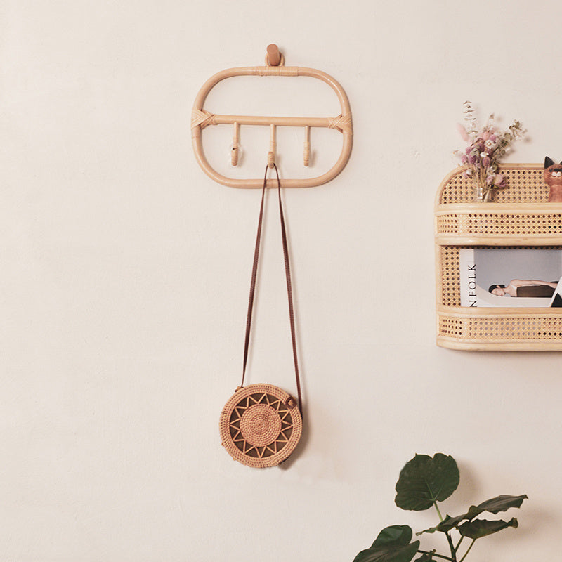 Rounded rectangle rattan wall coat rack with three hand woven hooks