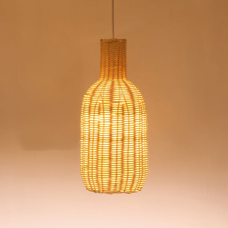 Tall bottle shaped woven rattan pendant glowing warm