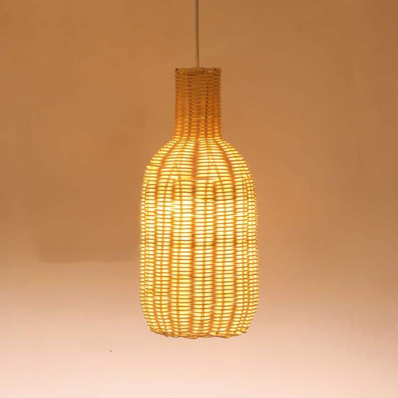 Tall bottle shaped woven rattan pendant glowing warm