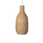 Tall bottle shaped woven rattan pendant glowing warm