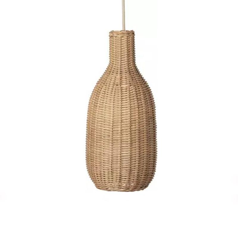 Tall bottle shaped woven rattan pendant glowing warm