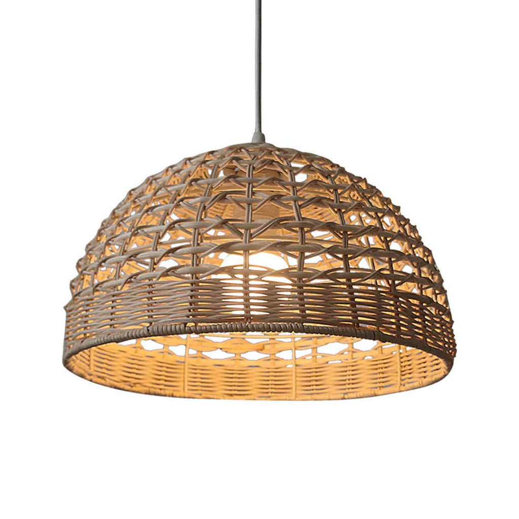 Handwoven rattan and wicker dome lamp shade hung over a table