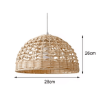 Handwoven rattan and wicker dome lamp shade hung over a table