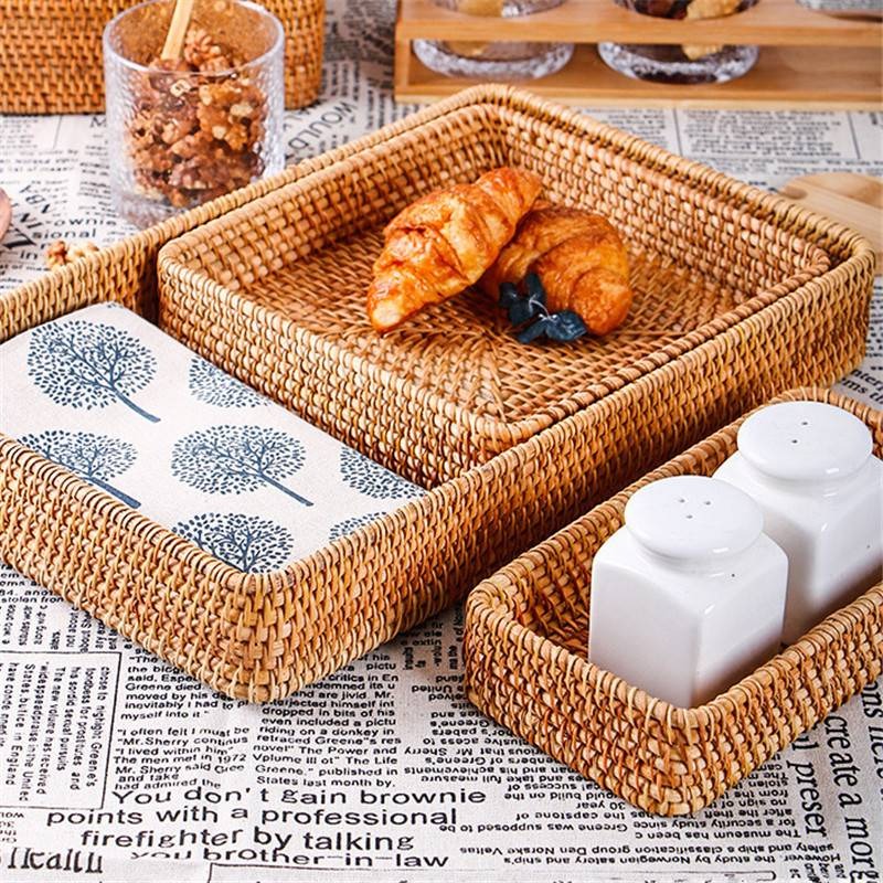Rectangular honey rattan tray baskets on a table