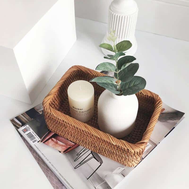 Rectangular honey rattan baskets holding bathroom products