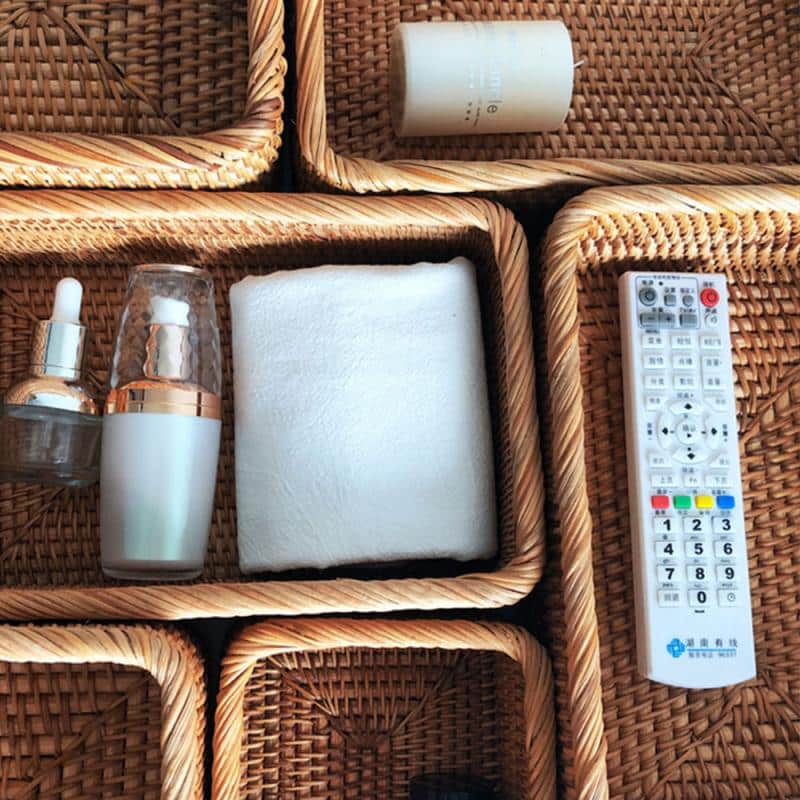 Rectangular honey rattan baskets holding bathroom products