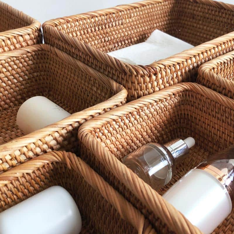 Rectangular honey rattan baskets holding bathroom products