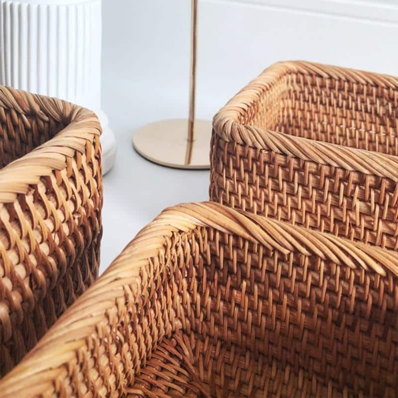 Rectangular honey rattan baskets holding bathroom products