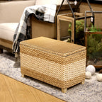 Rectangular hand woven rattan storage stool with a lift off lid on wood feet