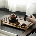 Rectangular handwoven bamboo tray with raised edges