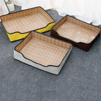 Low rectangular woven pet bed with orange edging