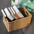 Rectangular woven rattan storage basket holding books