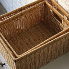Rectangular woven rattan storage basket holding books