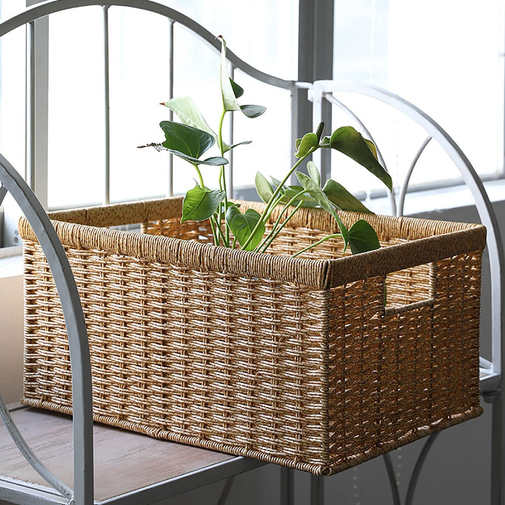 Rectangular woven rattan storage basket holding books