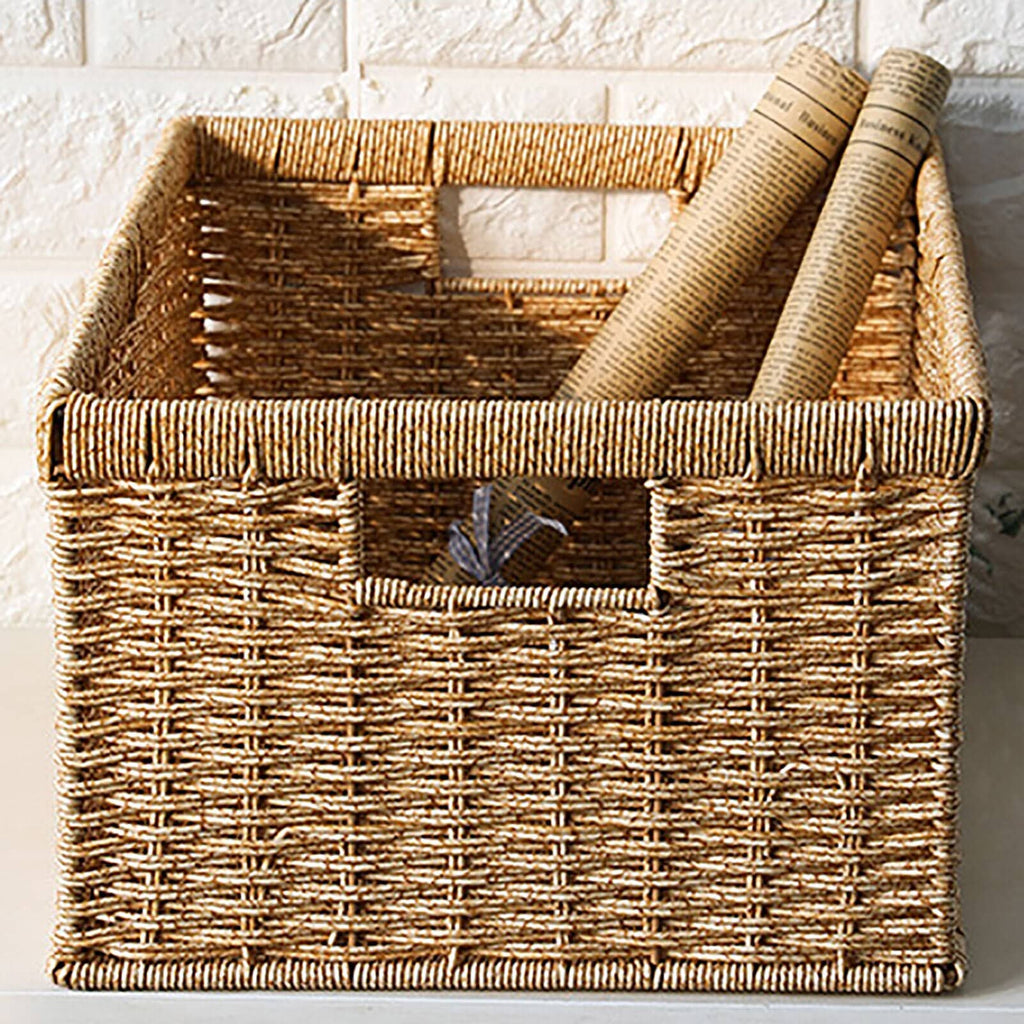 Rectangular woven rattan storage basket holding books
