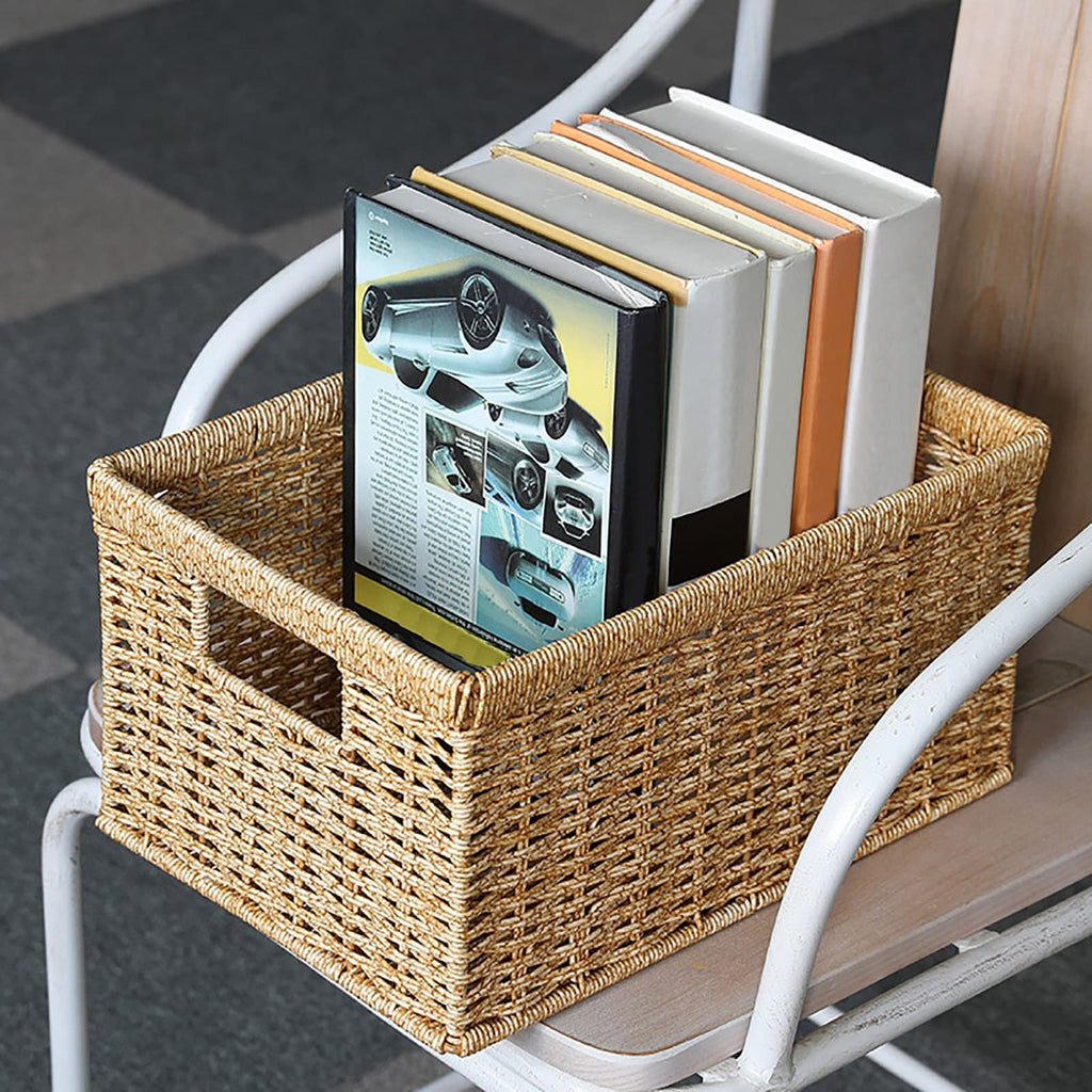 Rectangular woven rattan storage basket holding books