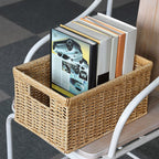 Rectangular woven rattan storage basket holding books