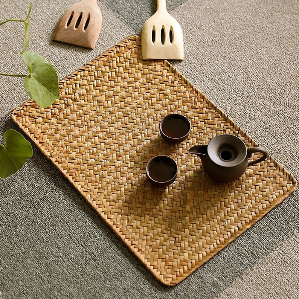 Rectangular hand woven golden seagrass placemat with a ribbed texture