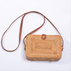 Structured rectangular hand woven straw shoulder bag with a single handle