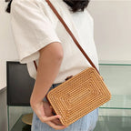 Structured rectangular hand woven straw shoulder bag with a single handle