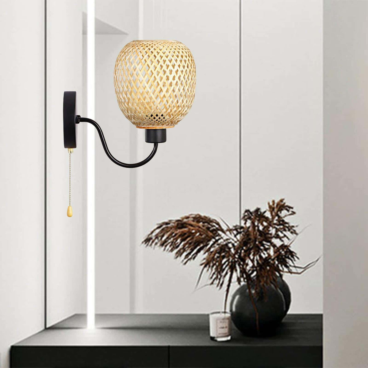 Retro wall sconce with a hand woven bamboo shade on a curved black iron arm