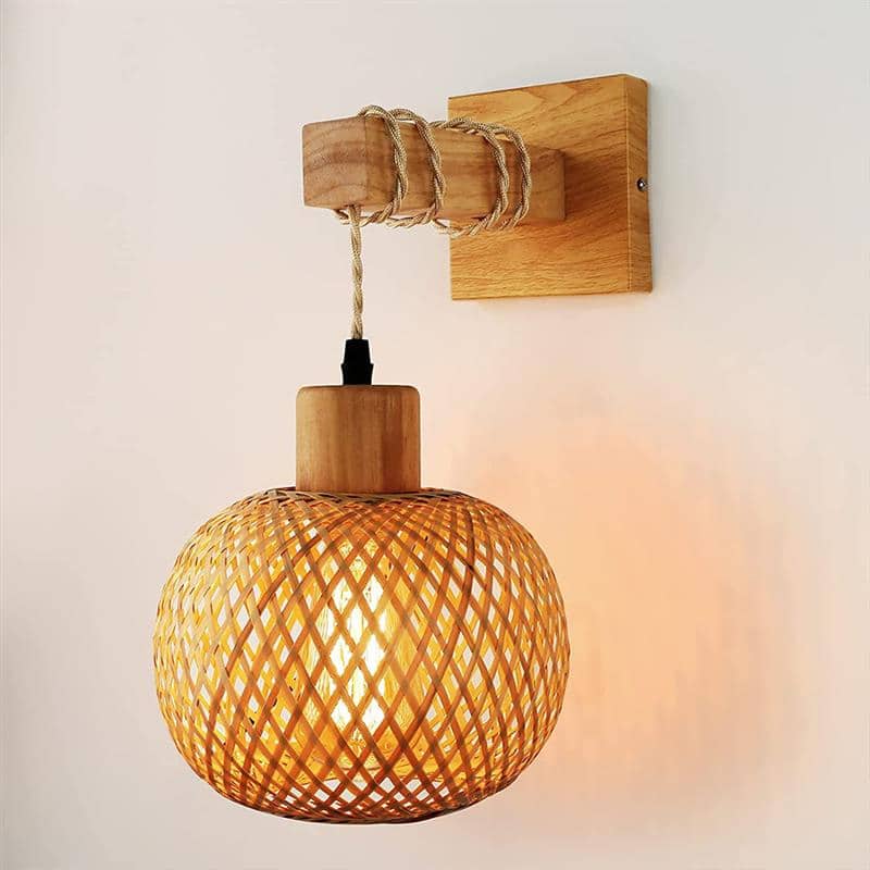 Retro wall sconce with a hand woven rattan shade on a wooden arm