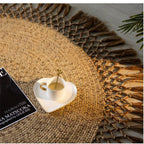 Round jute rug with a looped openwork fringe