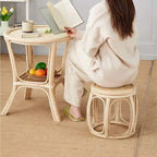 Low round hand woven wicker stool with a retro look