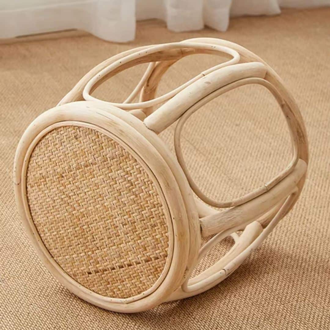 Low round hand woven wicker stool with a retro look