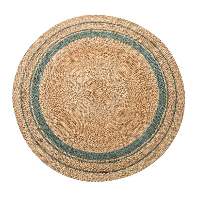 Round braided natural rug with a teal ring and thin dark stripes