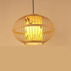Round woven bamboo lantern pendant with glowing inner shade