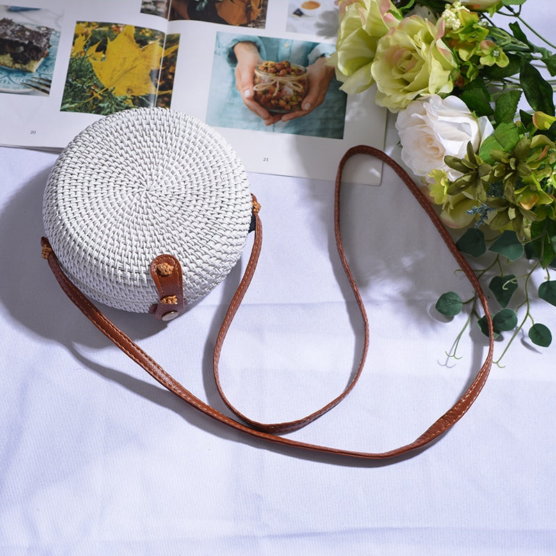Round hand woven rattan shoulder bag in a boho style