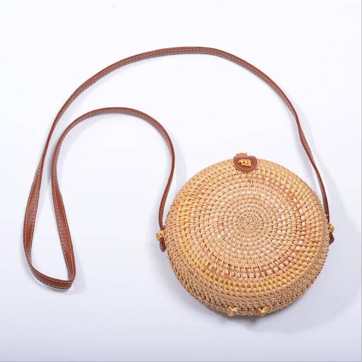 Round hand woven rattan shoulder bag in a boho style